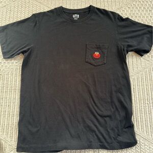 Uniqlo x KAWS x Sesame Street Elmo pocket t-shirt.